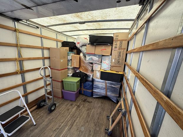 Mixed household items in the moving truck